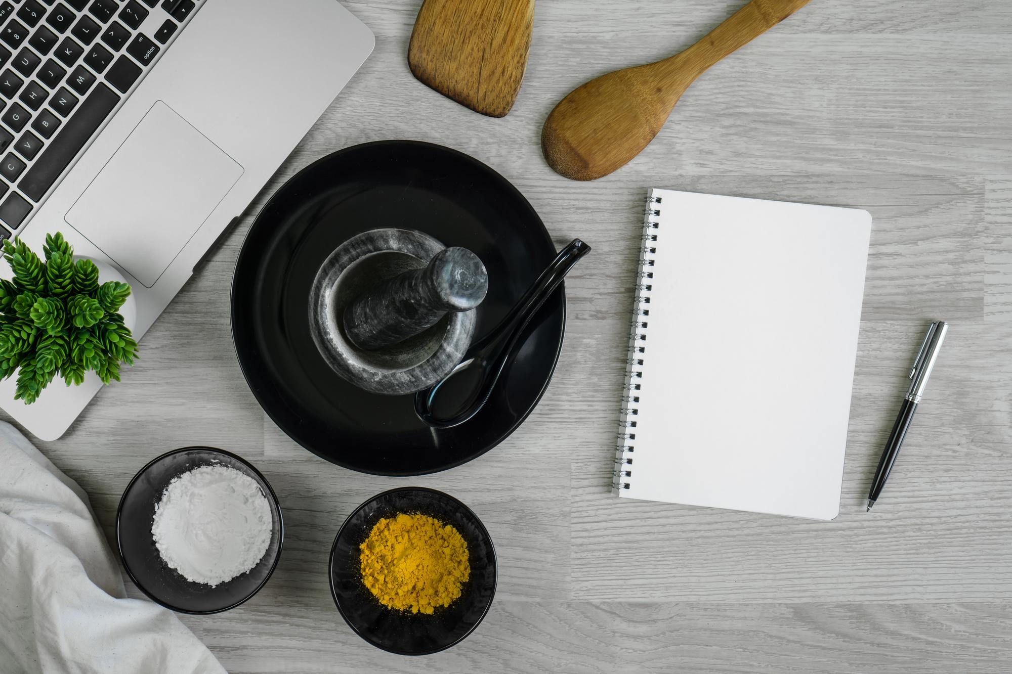 workbench with recipe notes and plated food
